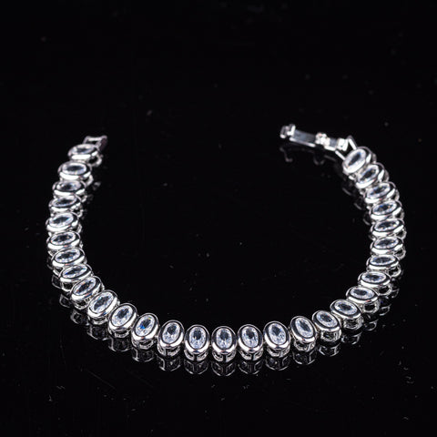 White Gold Oval Cut Bezel-Set Tennis Bracelet