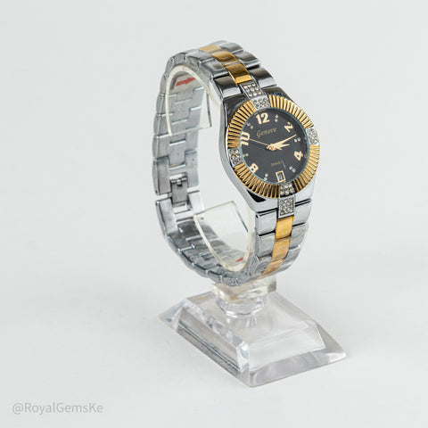 A two-tone stainless steel and gold wristwatch with a black dial, displayed on a clear acrylic stand against a light gray background.