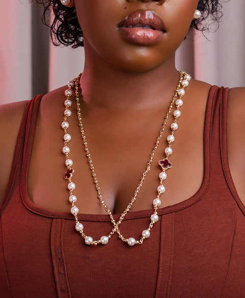 Woman wearing a pearl necklace with a blurred background